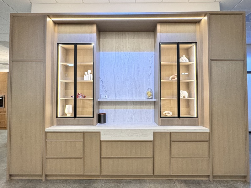 Illuminated white oak display cabinet wall