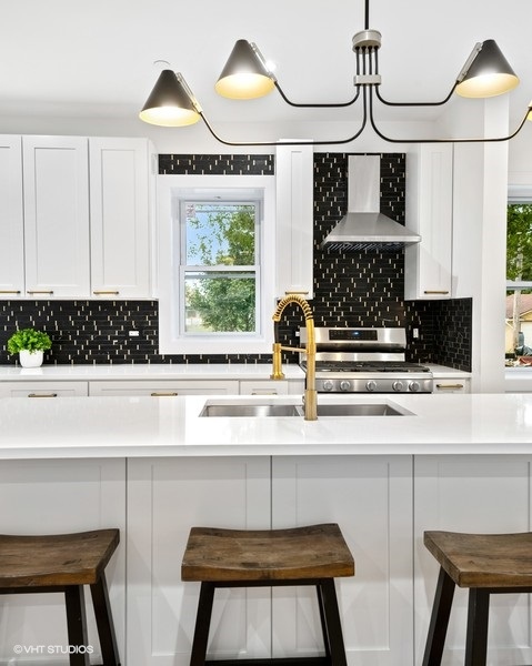 Chic kitchen upgrade with black mosaic backsplash and brass faucet, Chicago