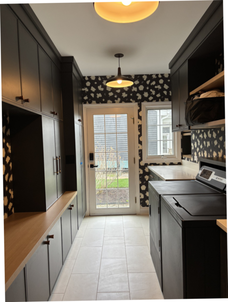 Laundry room transformation with black cabinetry and wood counters