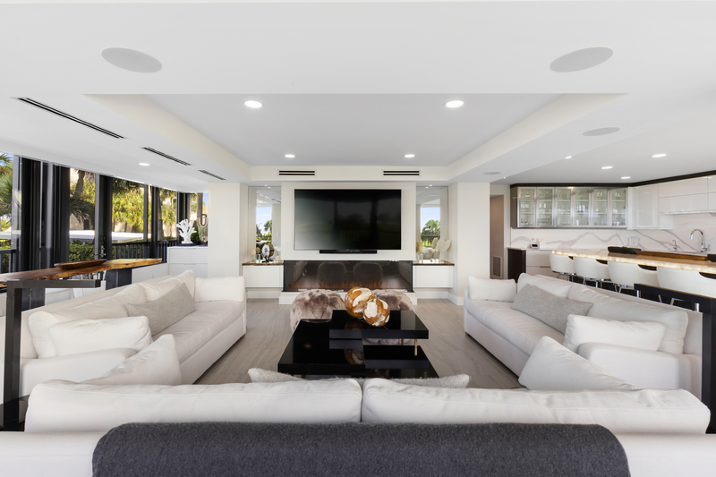 Grand TV salon with custom built-in millwork