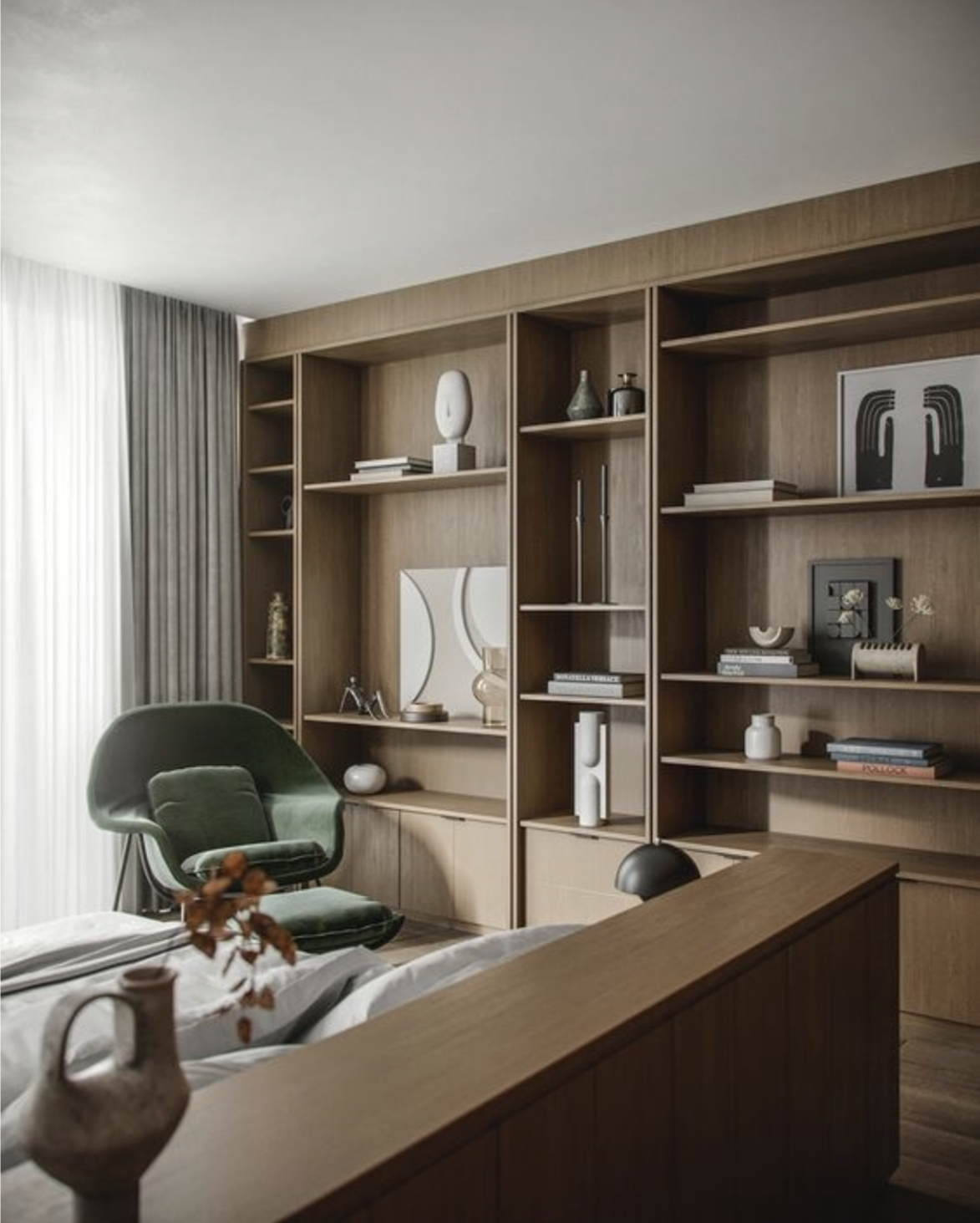 Warm white oak home office shelving with built-in desk and reading nook